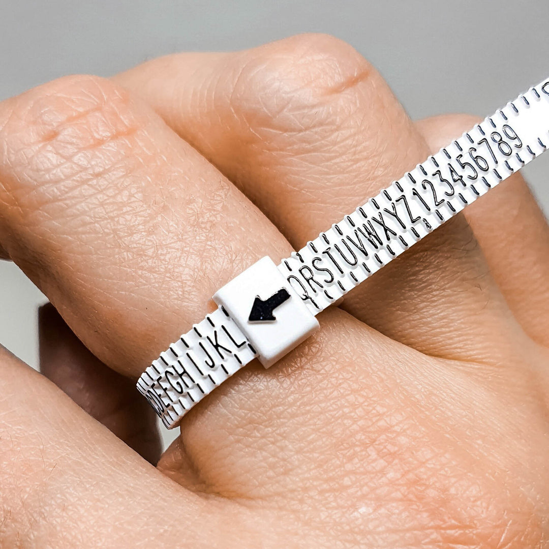 Close up of ring sizer on a finger