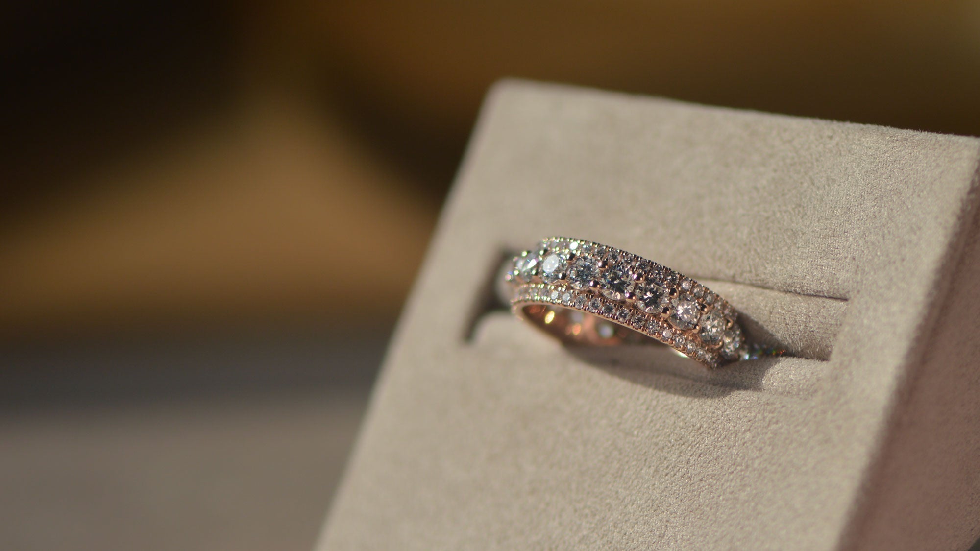 Close up of a men's bespoke wedding band set with lab grown diamond in recycled gold. 