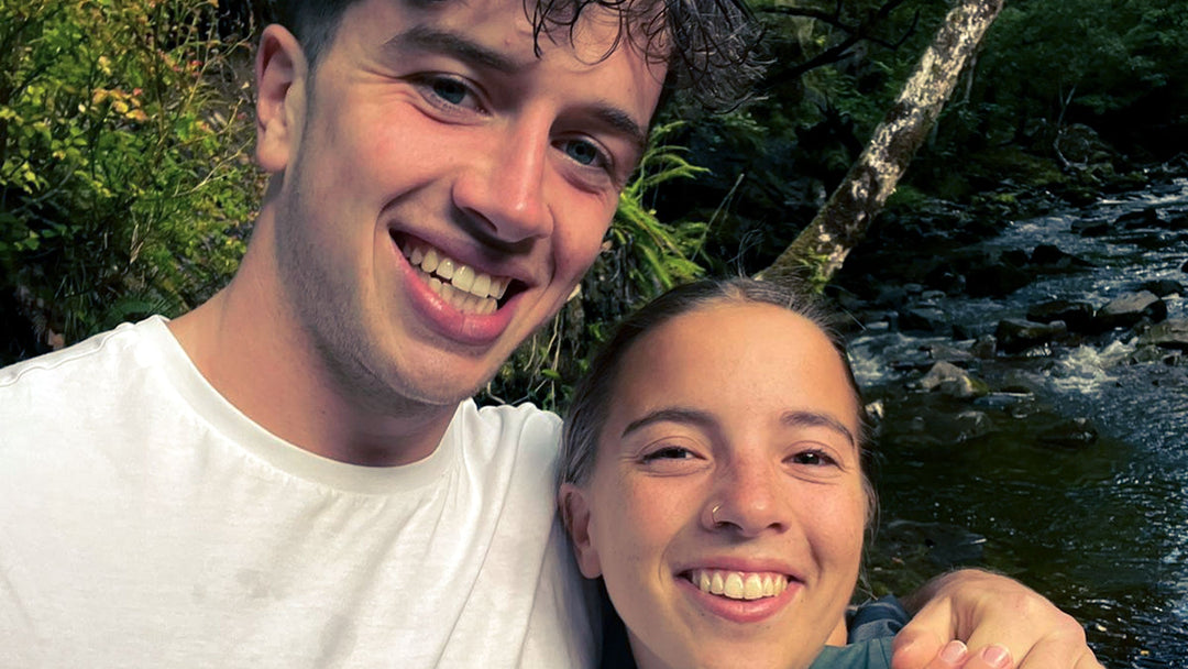 a couple happy in the woods after a proposal