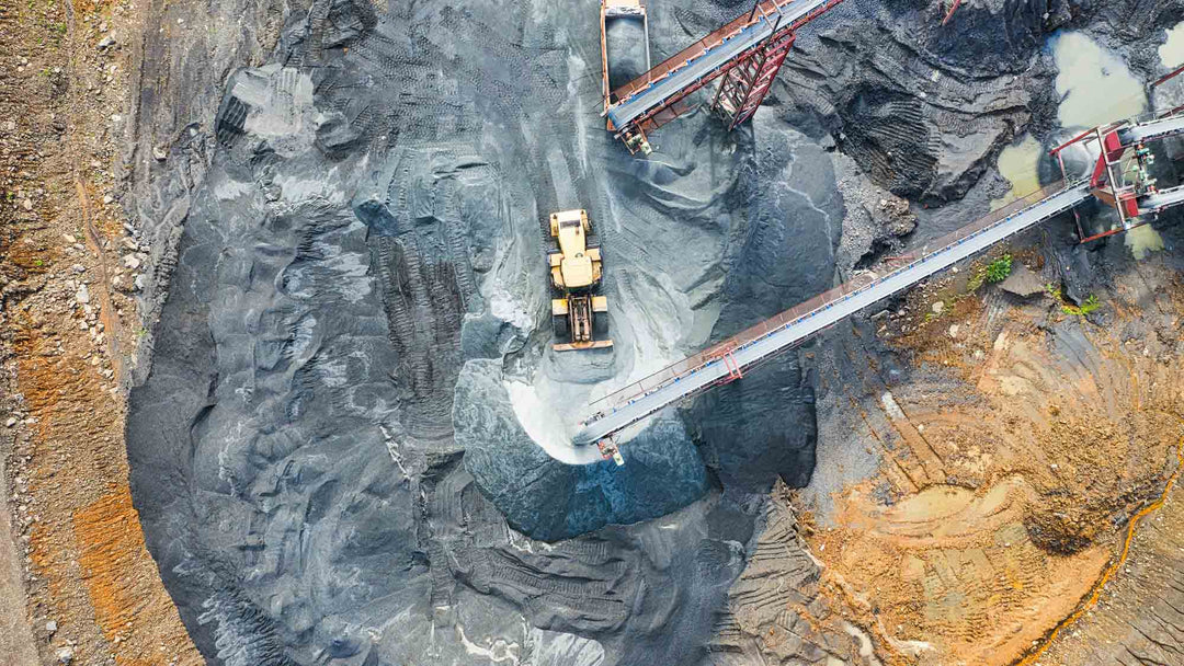 Aerial view of a mining operation showing damage to the landscape by heavy machinery 