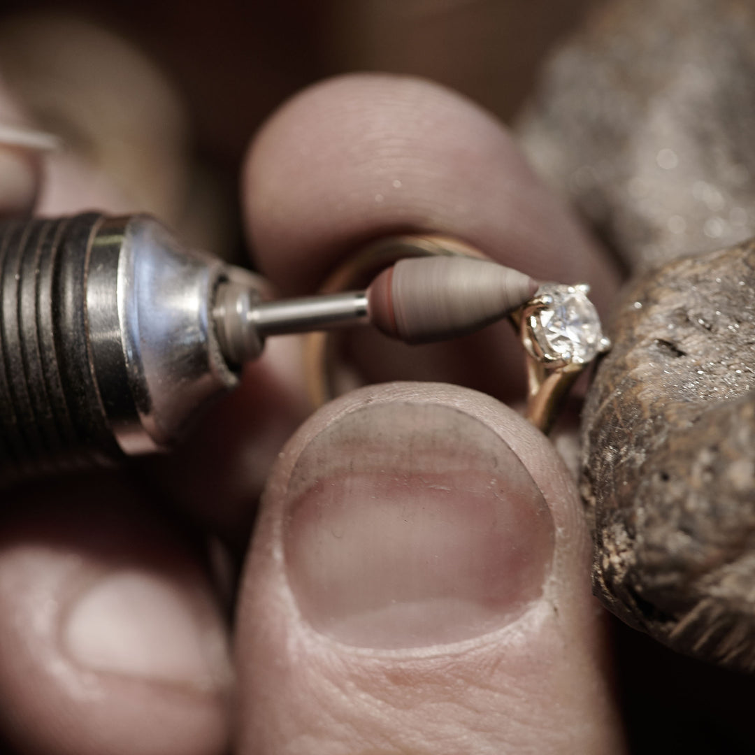 Close-up of a lab grown diamond being set into a bespoke engagement ring.