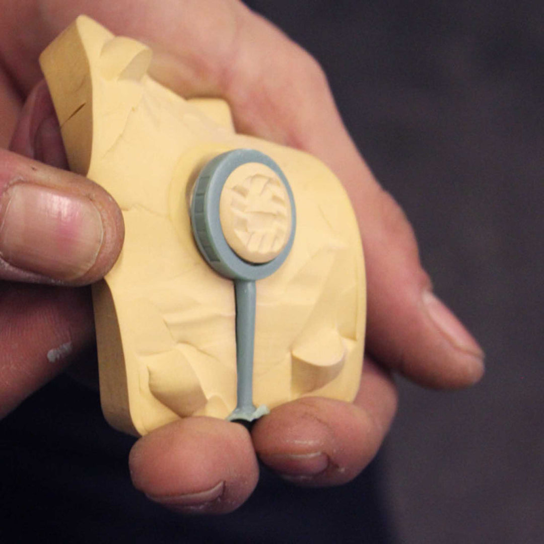 Behind the scenes in a jewellery workshop showing the wax for a bespoke diamond ring
