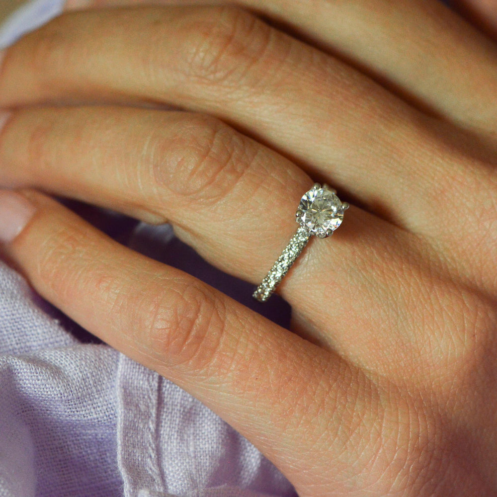 Round brilliant cut engagement ring on the hand