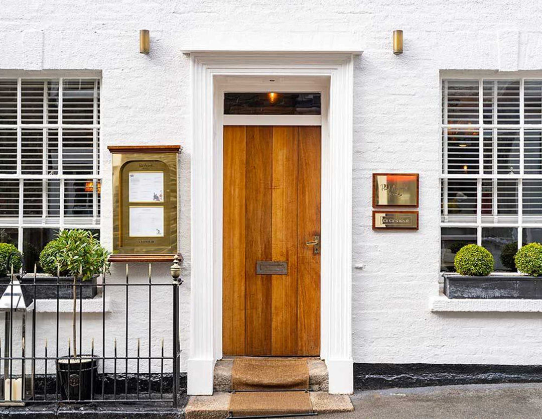 The welcoming wooden front door of Paul Ainsworth at No. 6 Padstow