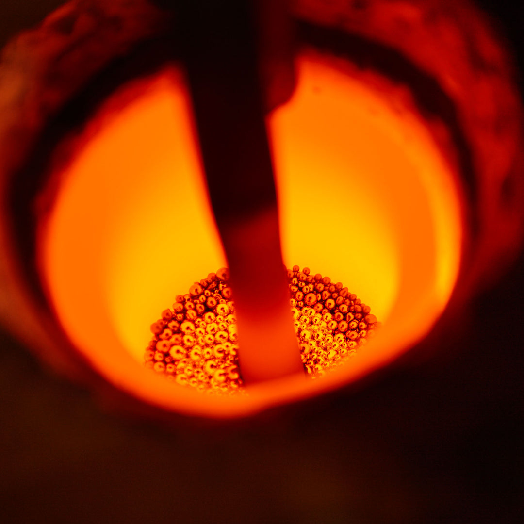 Close-up of fair trade 18k gold being smelted to make a bespoke lab grown diamond engagement ring.