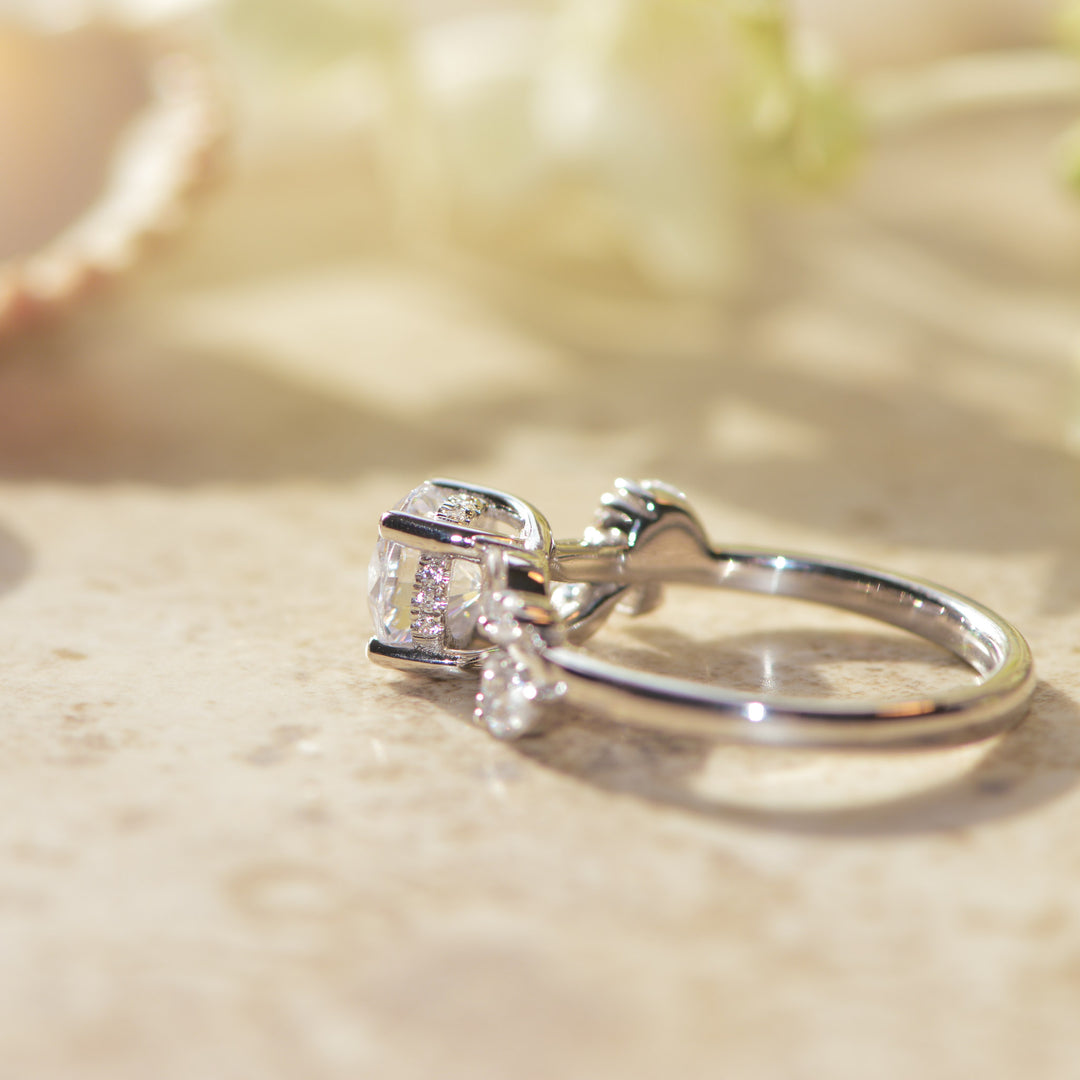 Platinum ring with a hidden halo set with diamonds on a light background