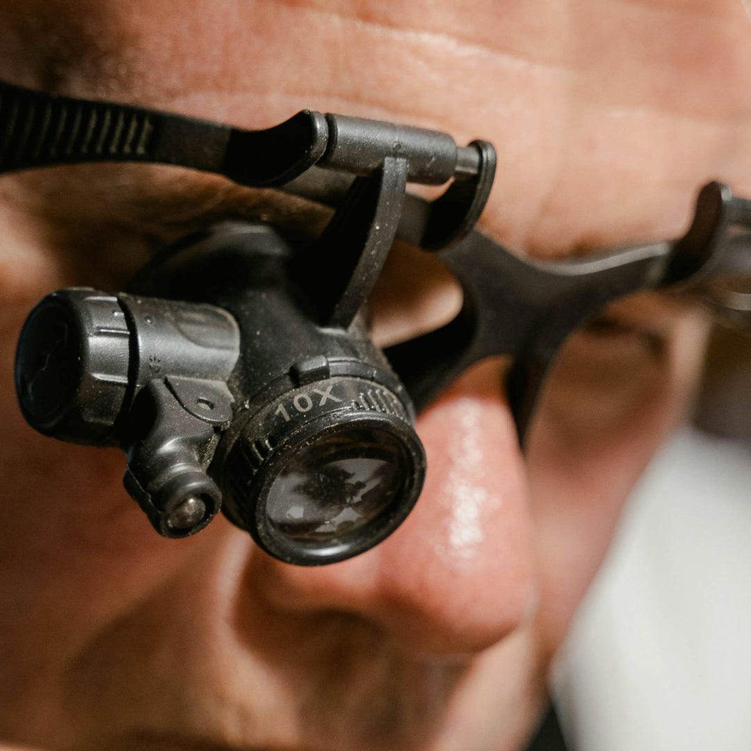 close up of a goldsmith wearing a loupe